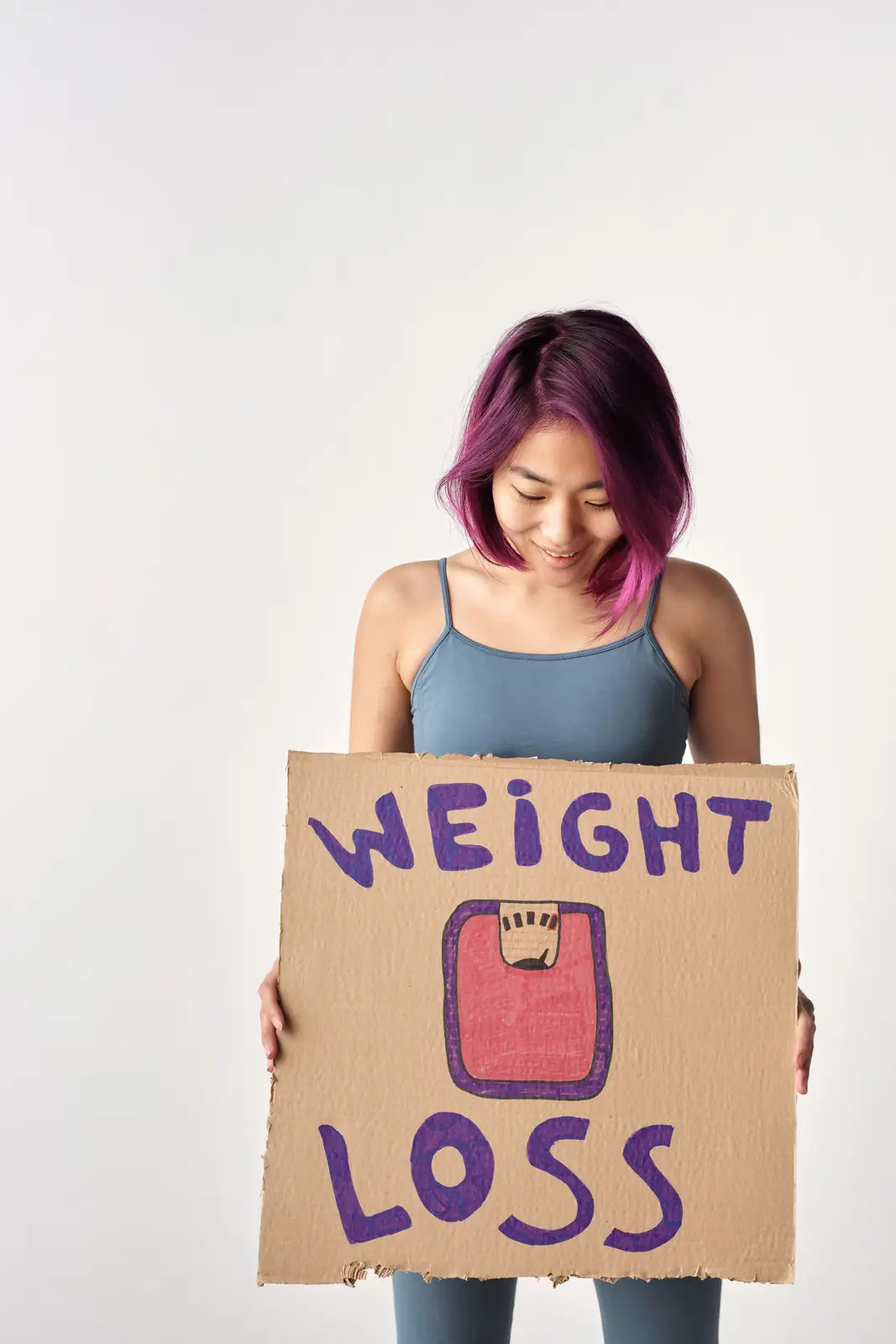 Looking down at a hand-drawn weight loss sign
